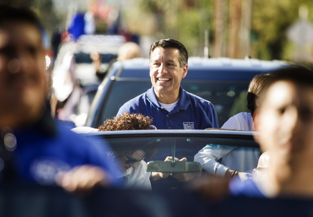 Nevada Governor Brian Standoval during the Nevada Day Parade on Fourth Street in downtown Las Vegas on Friday, Oct. 31. Thousands lined the street to celebrate Nevada's Sesquicentennial. (Jeff ...