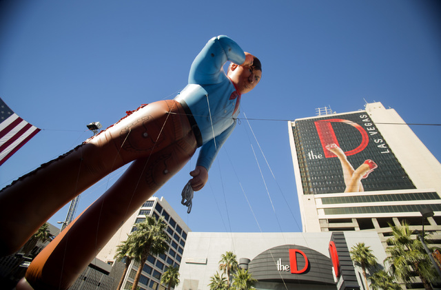 The Cox Cable inflatable cowboy during the Nevada Day Parade on Fourth Street in downtown Las Vegas on Friday, Oct. 31. Thousands lined the street to celebrate Nevada's Sesquicentennial. (Jeff ...