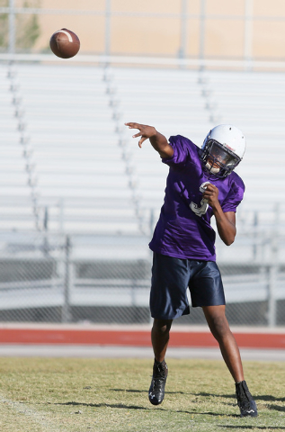 Sunrise Mountain senior quarterback Damon Heard throws the ball during a practice at Sunrise Mountain High School Wednesday, Oct. 15, 2014, in Las Vegas. Sunrise Mountain won their third varsity g ...