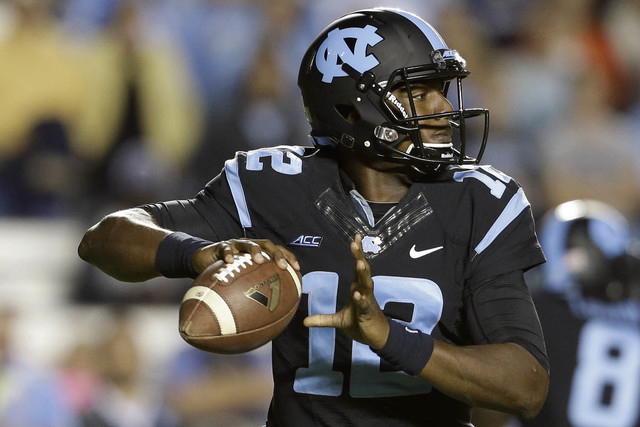 North Carolina quarterback Marquise Williams looks to pass the ball during the first half of an NCAA college football game against Georgia Tech in Chapel Hill, N.C., Saturday, Oct. 18, 2014. (AP P ...