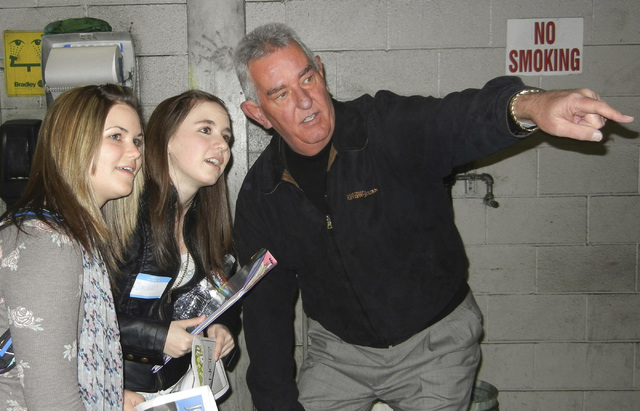 Always a mentor for young journalists, Charlie Waters, right, director of editorial support services for the Las Vegas Review-Journal, explains the newspaper printing process to West Career & Tech ...