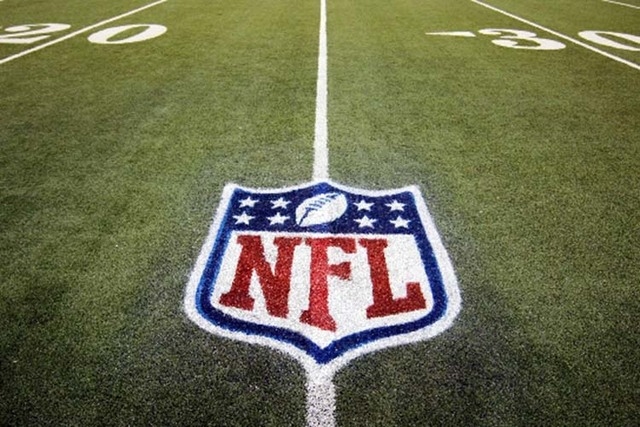 In this Nov. 20, 2011, file photo, an NFL logo is displayed on the Ford Field turf before an NFL football game. (AP Photo/Carlos Osorio, File)