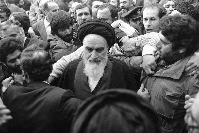Ayatollah Khomeini is thronged by his supporters after delivering his speech at the airport in Tehran Thursday, Feb. 1, 1979, the day of his return from 14 years of exile. (AP Photo)