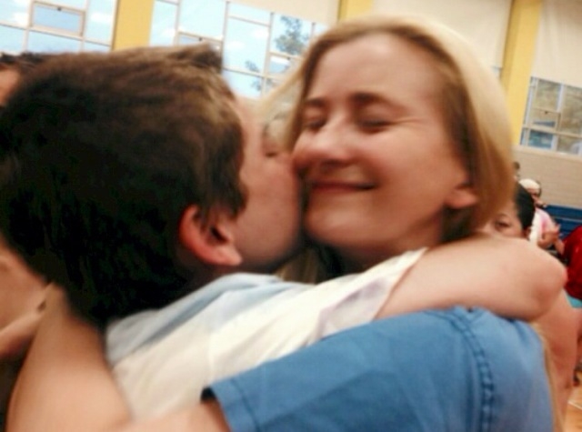 COURTESY
Dennis Moore hugs his mother, Elizabeth Moore, at a parent event in Boston.