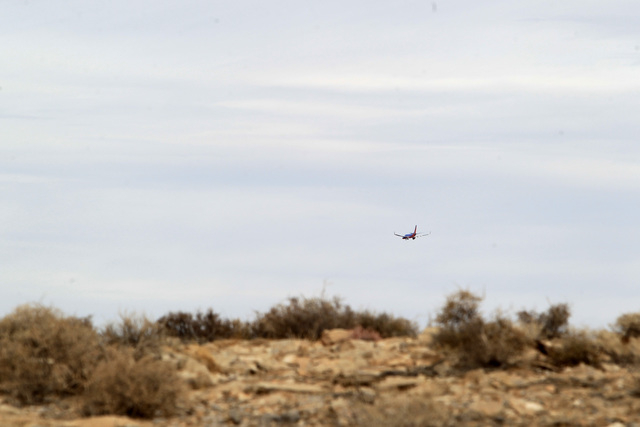 A Southwest Airlines jet is seen from the crash site of Bonanza Flight 114 as it makes its approach to McCarran International Airport Thursday, Nov. 13, 2014. (Sam Morris/Las Vegas Review-Journal)