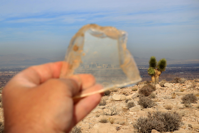 The Strip is seen through a piece of broken window at the crash site of Bonanza Flight 114 about 15 miles southwest of McCarran International Airport Thursday, Nov. 13, 2014. (Sam Morris/Las Vegas ...