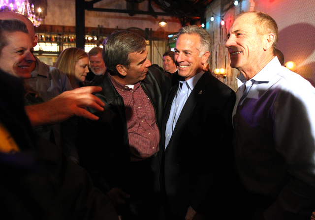 Las Vegas police Assistant Sheriff Joe Lombardo, center, celebrates with current Sheriff Doug Gillespie, left, and former Sheriff Bill Young after final results showed him winner of the Clark Coun ...