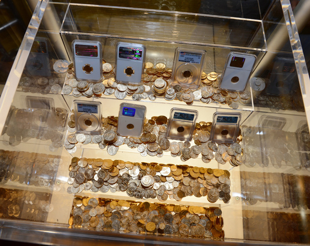 Gold coins worth $500,000 set to be awarded to the first eligible reader who solves the interactive puzzle in the book "Endgame: The Calling" are on display at Caesars Palace in Las Vegas. (Denise ...