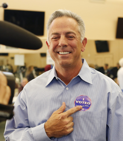 Clark County sheriff candidate Joe Lombardo addresses the media as he points to his "I Voted" sticker after casting his vote Tuesday, Nov. 4, 2014, at Las Ventanas Community Center, 10401 W. Charl ...