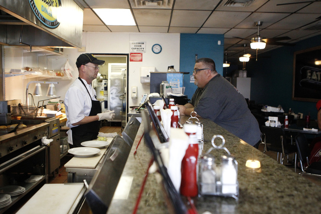 Robert Polk, left, owner and chef at at Kailyn's Diner, speaks with customer David Kaempfer during breakfast service at his restaurant, 3430 E. Tropicana Ave., suite 6, Sunday, Nov. 9, 2014. (Erik ...