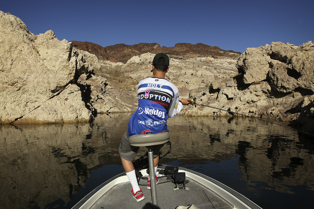 Fourteen-year-old Zach Holt casts his line while fishing with his father Paul Holt, not pictured, on Lake Mead, Aug. 14, 2013. Zach recently qualified to compete in the upcoming U.S. Open Bass Fis ...