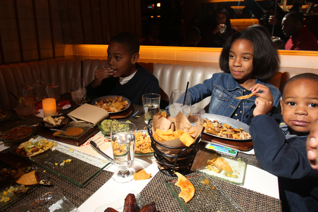 Bryce Jackson, 10, from left, his sister Bailey, 7, and brother Bryce, 3, dine with their parents at Mercadito restaurant inside Red Rock Resort in Las Vegas Saturday, Nov. 22, 2014. (Erik Verduzc ...