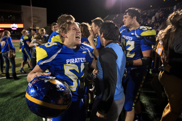 Moapa Valley players celebrate their defeat of Desert Pines during their Division 1-A championship game Saturday, Nov. 22, 2014 at Bishop Gorman. After trailing by 20 at the half, Moapa Valley cam ...