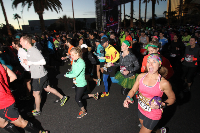 A group of runners cross the start line in the Las Vegas Rock 'n' Roll  Marathon and half marathon on the Strip on Sunday, Nov. 16, 2014. (K.M.  Cannon/Las Vegas Review-Journal) |