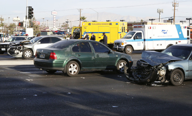 The accident scene where one person was killed and six others were injured in a multi-vehicle crash at Sahara Avenue and Fremont Street Thursday, Nov. 27, 2014. Two people in the scooter were take ...