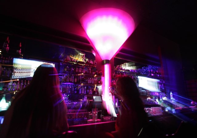 Dancer sit in the bar area at Sapphire Gentlemen's Club in Las Vegas, June 23, 2004. (John Gurzinski/Las Vegas Review-Journal)
