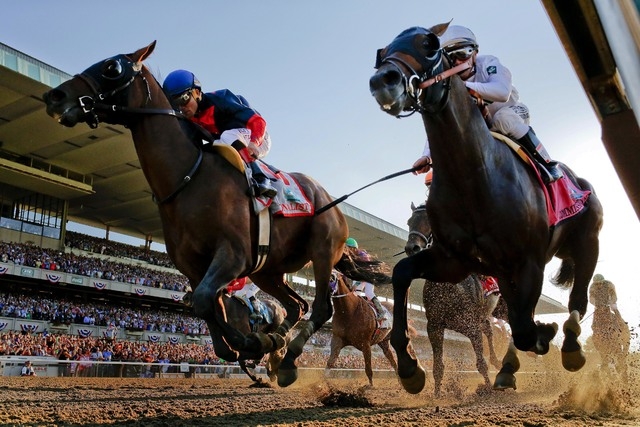 Tonalist, left, with Joel Rosario up edges out Commissioner with Javier Castellano up to win the 146th running of the Belmont Stakes horse race, Saturday, June 7, 2014, in Elmont, N.Y. (AP Photo/M ...