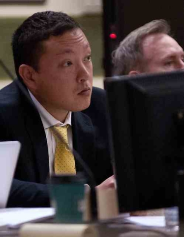 Markus Kaarma sits with his legal team during witness testimony in Missoula County Court in Missoula, Montana December 5, 2014. Markus Kaarma, 30, is charged with deliberate homicide in the death ...