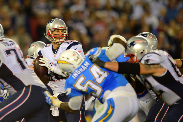 AFC East: New England Patriots -- Quarterback Tom Brady (12) drops back to pass against the San Diego Chargers during the fourth quarter at Qualcomm Stadium on Dec. 7, 2014. (Jake Roth-USA TODAY S ...