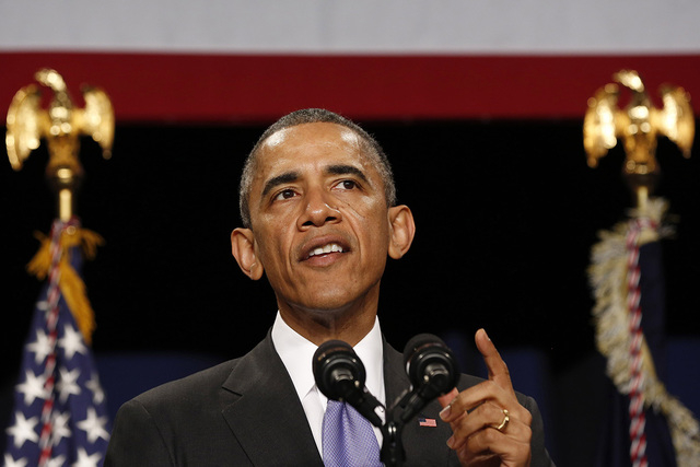 U.S. President Barack Obama speaks at an event for the Senior Executive Service (SES) while at the Washington Hilton in Washington, December 9, 2014. (REUTERS/Larry Downing)