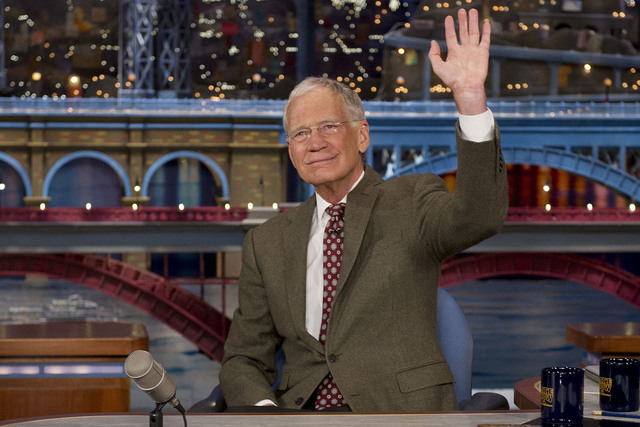 In this April 3, 2014 file photo provided by CBS, David Letterman, host of the “Late Show with David Letterman,” waves to the audience in after announcing his retirement during a taping in New ...