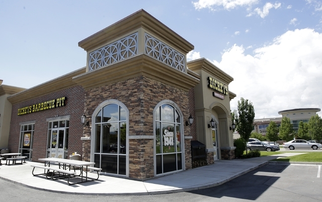 FILE - This Aug. 14, 2014, file photo, shows the exterior of Dickey's Barbecue Pit in South Jordan, Utah. Jan Harding has reached a settlement with the barbecue chain restaurant where she unknowin ...