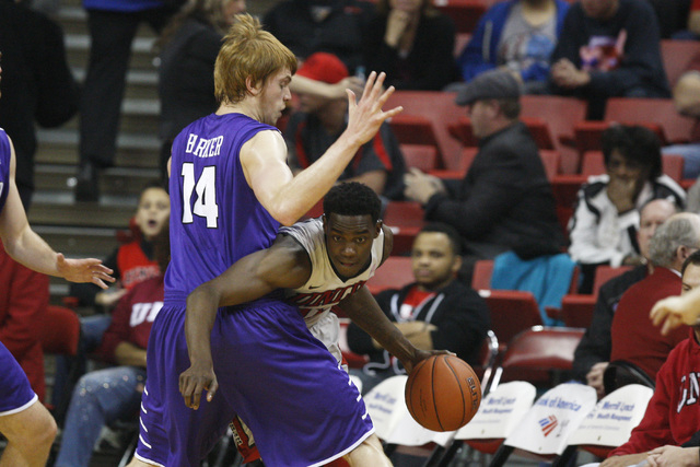 UNLV forward Dwayne Morgan tries to get around Portland center Riley Barker during the first half of their game Wednesday, Dec. 17, 2014 at the Thomas & Mack Center. (Sam Morris/Las Vegas Review-J ...