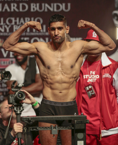 Amir Khan strikes a pose during the official weigh-in at the MGM Grand Garden Arena in Las Vegas, Friday, Dec. 12, 2014. (Donavon Lockett/Las Vegas Review-Journal