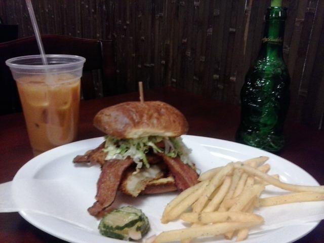 The Chicken Katsu Club sandwich is shown with Thai iced tea at Buddha Belly Deli, 50 N. Valle Verde Drive, No. 110 (Gina Pearl/Special to View)