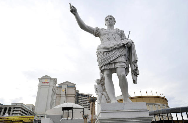 A statue on display is seen in front of Caesars Palace hotel-casino on Thursday, Dec. 11, 2014, in Las Vegas.  (David Becker/Las Vegas Review-Journal)