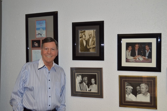 Bruce Merrin, CEO of Bruce Merrin Public Relations & Celebrity Speakers Entertainment, shows off his office collection of photos of clients including Ed McMahon, Jackie Robinson, and Merv Griffin. ...