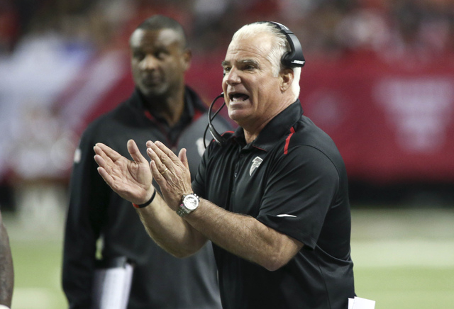 Atlanta Falcons head coach Mike Smith cheers on his team after a field goal in the second quarter of their game against the Arizona Cardinals at the Georgia Dome on Nov. 30, 2014. (Jason Getz-USA  ...