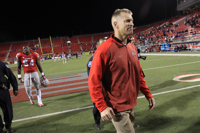 UNLV head coach Bobby Hauck leaves the field after the game against Nevada Saturday, Nov. 29, 2014 at Sam Boyd Stadium. Nevada won 49-27. (Sam Morris/Las Vegas Review-Journal)