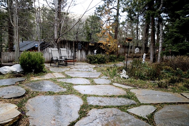 Tonya Harvey/Real Estate Millions 
The Mount Charleston cabin that Realtors Angie and  Garry Tomashowski have lived in for more than 20 years features a patio area.