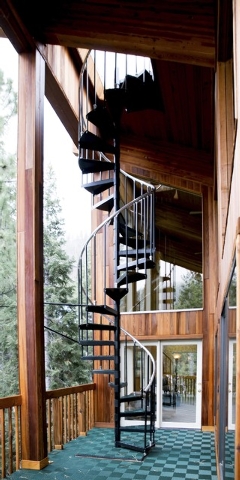 Garry Tomashowski refurbished this 3,500-square-foot Mount Charleston cabin. This spiral staircase connects the different levels. (Tonya Harvey/Real Estate Millions)