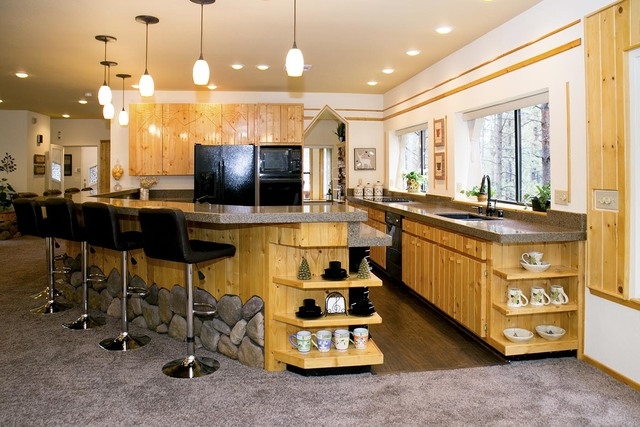 Garry Tomashowski refurbished this 3,500-square-foot Mount Charleston cabin. It's priced at $939,000. The kitchen features pine wood and river rocks. (Tonya Harvey/Real Estate Millions)