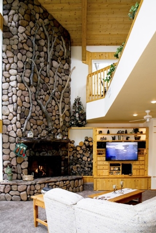 Garry Tomashowski refurbished this 3,500-square-foot Mount Charleston cabin. It's priced at $939,000. The living room has a fireplace. (Tonya Harvey/Real Estate Millions)