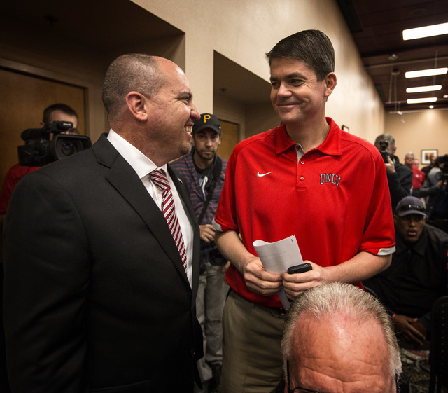 New UNLV's Men's football coach Tony Sanchez,left, talks to men's basketball coach Dave RIce, Thursday, Dec. 11,2014, at Stan Fulton Building. Sanchez, former Bishop Gorman High School coach, is ...