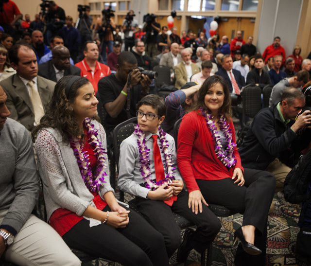 Tessie Sanchez,right, with her children Alyssa, 13,left, and Jason during a press conference to introduced her husband Tony Sanchez as new UNLV's Men's football coach, Thursday, Dec. 11,2014, at ...