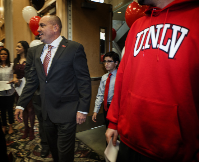 Tony Sanchez arrives at  Stan Fulton Building to be introduced  as new UNLV's Men's football coach on Thursday, Dec. 11,2014. Sanchez, former Bishop Gorman High School coach, is the 11th football  ...