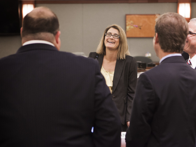 Clark County Chief District Judge Jennifer Togliatti, left, talks to counsel Tuesday, Dec. 16, 2014, at the Regional Justice Center after a settlement was reached in the $500 million civil damages ...