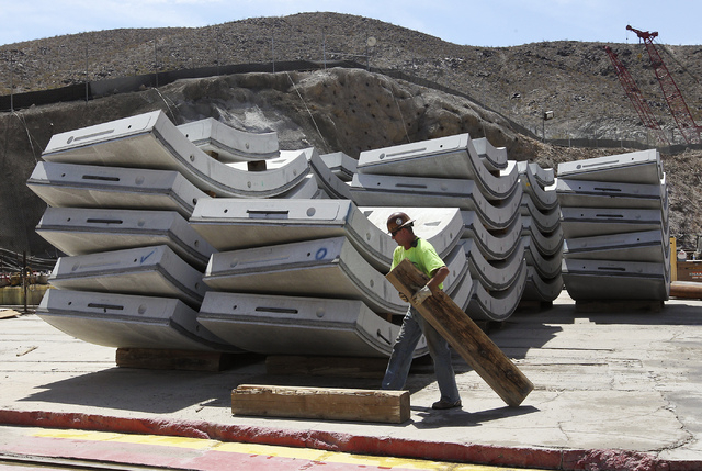 A Vegas Tunnel Constructors worker helps stage the  concrete slabs that are to be put in place behind the boring machine as the Southern Nevada Water Authority leads the Review-Journal on a tour o ...