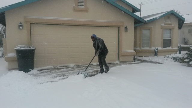 Tony Atwell of Kingman, Arizona, was prepared for Wednesday's storm as he was busy clearing snow from his driveway this morning. (Dave Hawkins/Las Vegas Review-Journal)