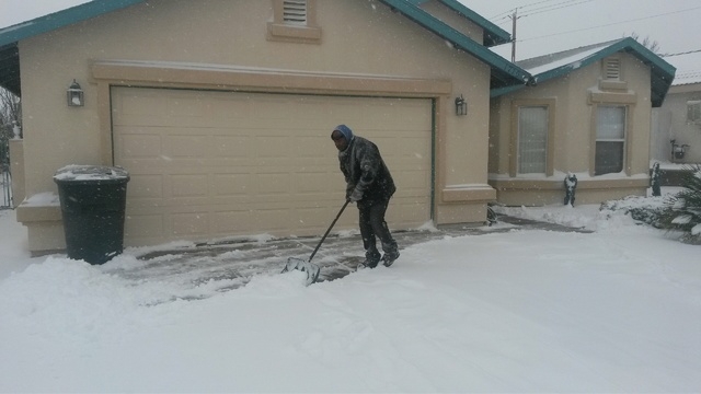 Tony Atwell of Kingman, Arizona, was prepared for Wednesday's storm as he was busy clearing snow from his driveway this morning. (Dave Hawkins/Las Vegas Review-Journal)