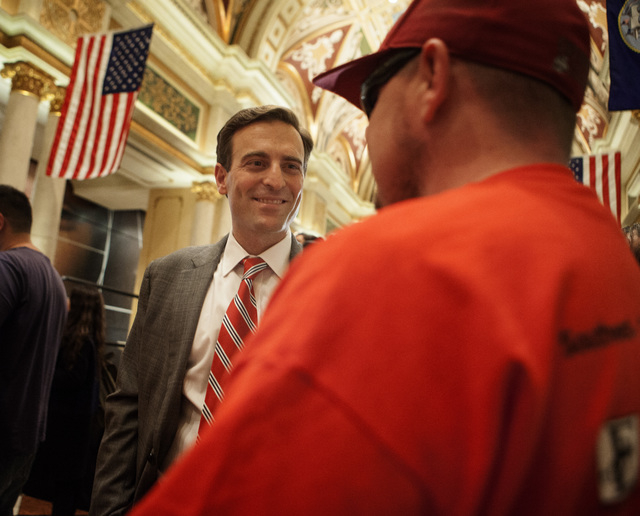 Nevada Attorney General-elect Adam Laxalt talks to wounded warrior Frankie Gomez during the Salute our Troops welcome ceremony at The Venetian on Wednesday, Dec. 03, 2014. (Jeff Scheid/Las Vegas R ...