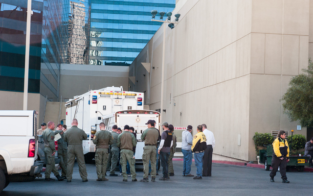 Las Vegas police and SWAT debrief after an armed person committed suicide in a hotel room at the MGM Grand hotel-casino in Las Vegas on Wednesday, Dec. 10, 2014. (Chase Stevens/Las Vegas Review-Jo ...