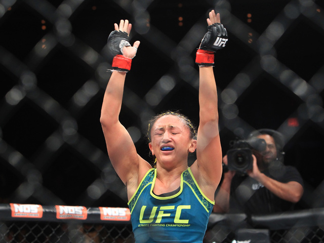 Carla Esparza reacts after submitting Rose Namajunas during their strawweight fight at The Ultimate Fighter finale Friday, Dec. 12, 2014 at the Palms. Esparza became the UFC's first female straw w ...