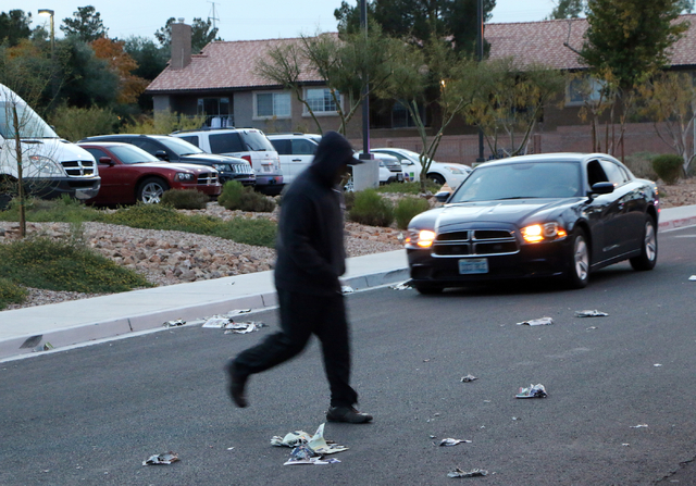 A Metro police officer simulates darting across a street while another Metro officer tries to avoid him during a news media pedestrian safety demonstration at Metro's traffic bureau at 8445 Eldora ...