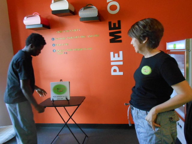 Feliciano Savilengo, left, works on a display at Pie Me Over Nov. 14, 2014, while co-owner Marje Hammond watches. The new business had a following in Boston, from which the owners hail. (Jan Hogan ...