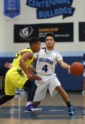 Centennial’s Terrance Traylor, right, passes the ball around Durango's Demetrius Valdez during a basketball game at Centennial High School Friday, Dec. 12, 2014, in Las Vegas. Centennial wo ...